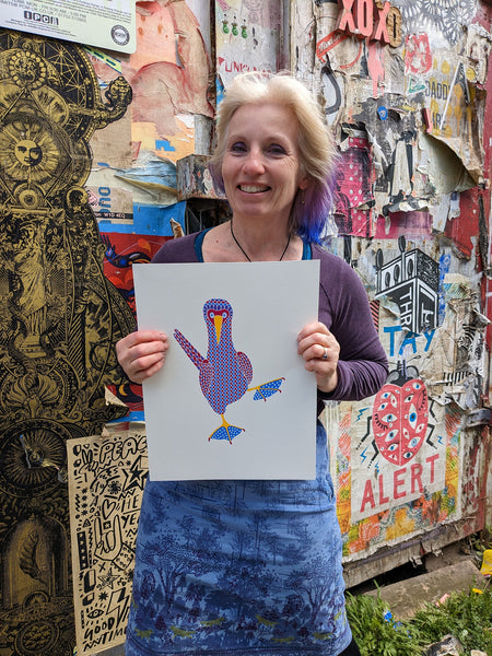 Pink, purple and blue patterned bird with a heart pattern on blue feet print