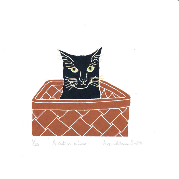 print of a Black cat in a basket