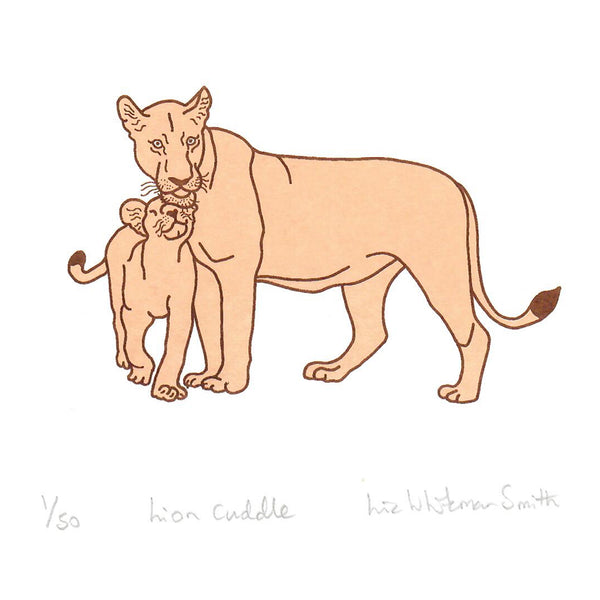 A print of a lion cub and its mother