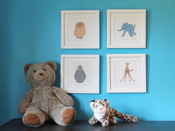 Baby animal prints on the wall in a child's bedroom