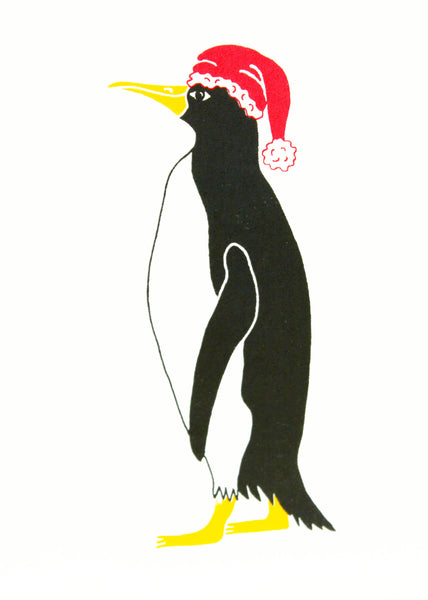 Penguin wearing a Christmas hat on a hand printed Christmas card