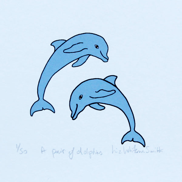 A print of a pair of blue dolphins leaping out of the water