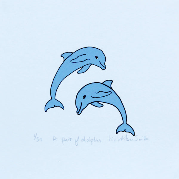 A print of a pair of blue dolphins leaping out of the water