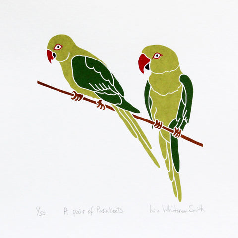 A print of two birds perched on a branch