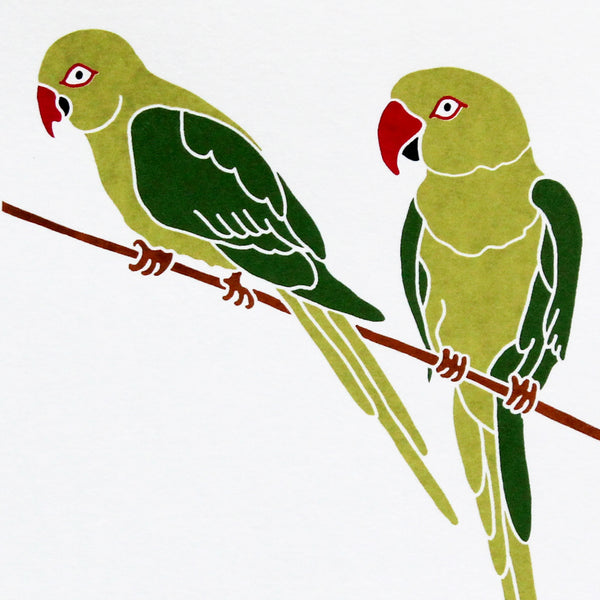 A print of two birds perched on a branch