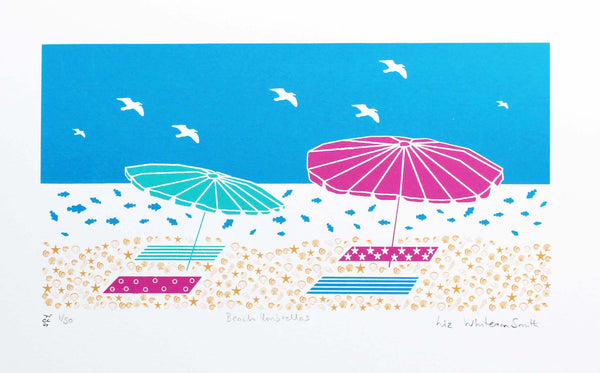 Summer beach scene of beach umbrellas and towels