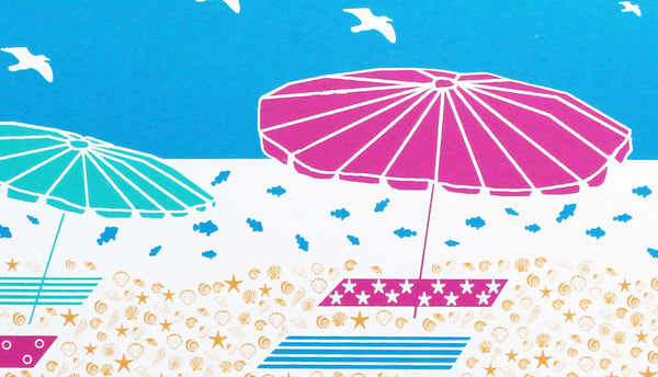 Summer beach scene of beach umbrellas and towels