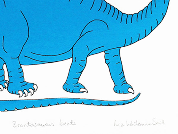 a print of a blue dinosaur listening to music wearing headphones