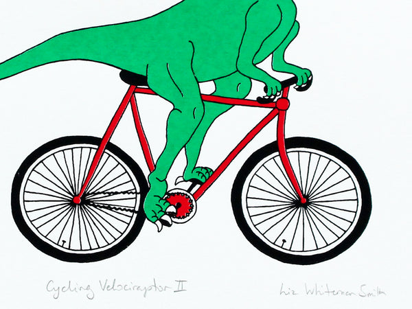 Print of a green velociraptor cycling along happily on a red bicycle