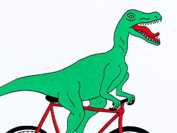 Print of a green velociraptor cycling along happily on a red bicycle
