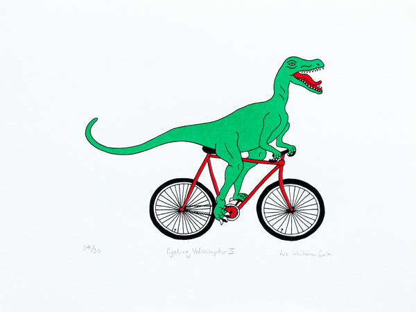 Print of a green velociraptor cycling along happily on a red bicycle
