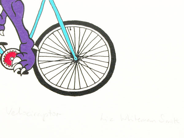 Print of a purple velociraptor cycling along happily on a teal bicycle