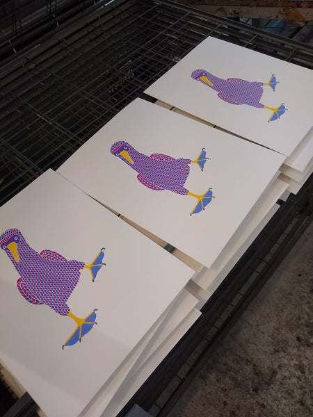 Dancing booby bird screen print, purple, pink and blue patterned bird with blue dotty feet