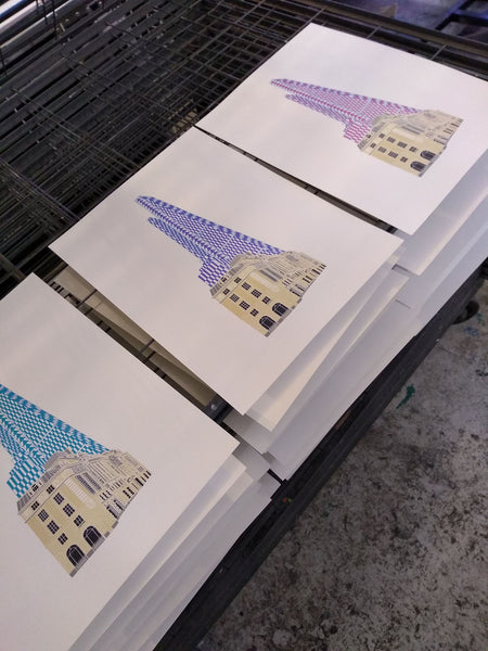 Blue scalpel building in London print on drying rack
