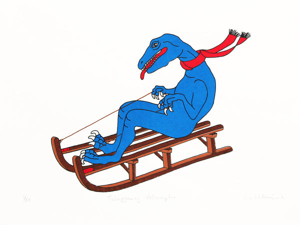 Blue velociraptor with a red scarf tobogganing