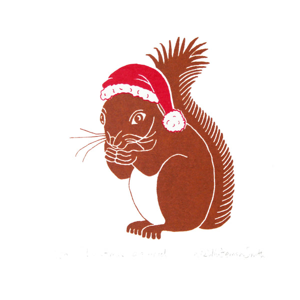 Brown squirrel wearing a red Christmas hat