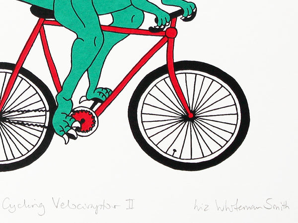 Green velociraptor cycling along happily on a red bicycle