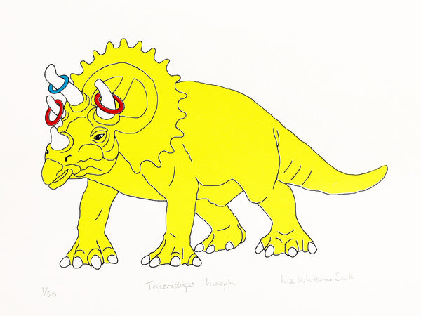 Yellow dinosaur with hoopla rings on its horns